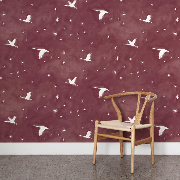 Wooden chair in front of a purple wall with swan pattern - Garnet – Starlit Wallpaper | Half Drop Match | 28" Trimmed | By Yard