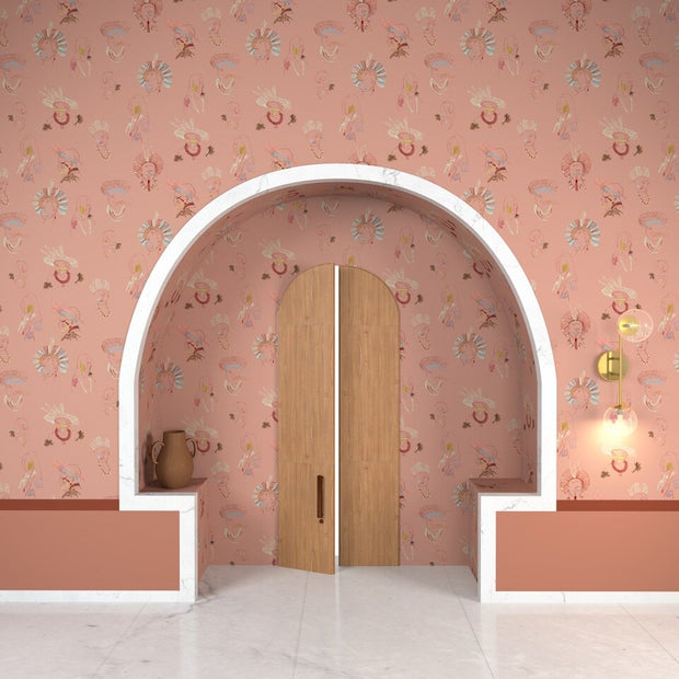 Decorative archway with floral-patterned pink wall and wooden door.