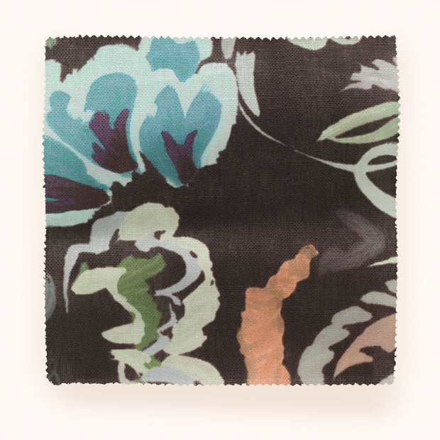 A yard of Bloomsbury Grande fabric with a floral pattern in blue, blush, brown, green, and pink colors on a black background.