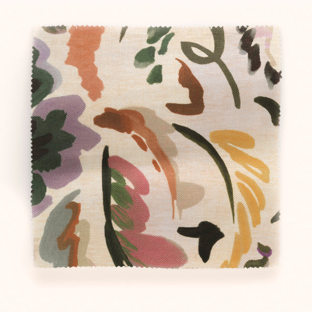A yard of Bloomsbury Grande fabric with an abstract floral pattern in multicolor on a yardstick.