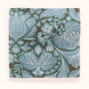 A swatch of blue, brown, and green floral patterned fabric.