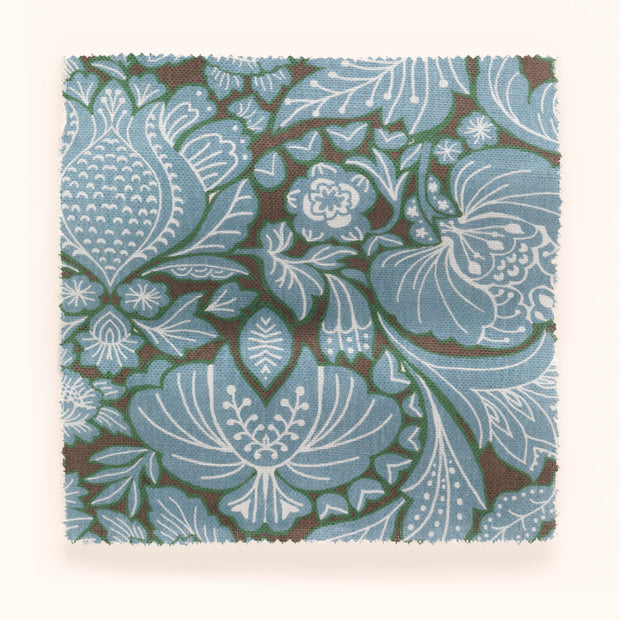 A swatch of blue, brown, and green floral patterned fabric.