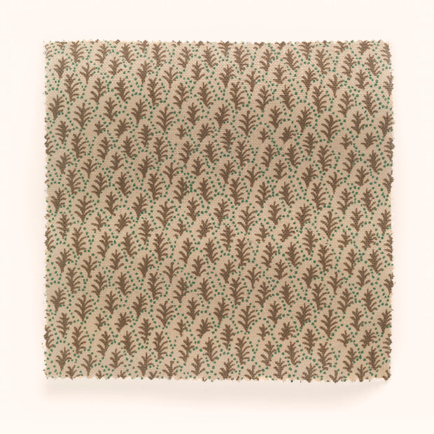 Yard fabric with a leaf pattern in beige, brown, and green colors