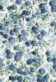 A roll of wallpaper featuring a floral pattern with blue flowers and green leaves on a cream background - Peony Parade Soft Blue Wallpaper – Luxury Floral Non-Woven Wall Décor