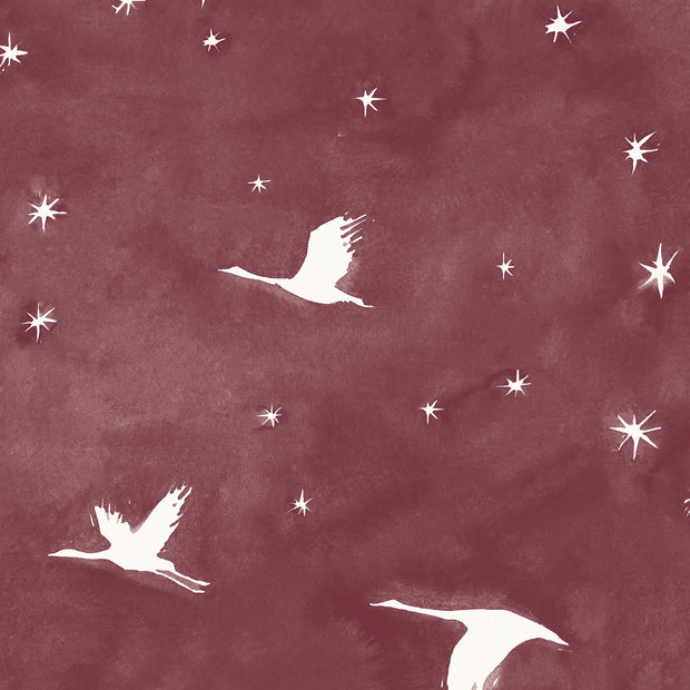 A section of wallpaper with a repeating pattern of white birds flying against a maroon background with white stars - Garnet – Starlit Wallpaper | Half Drop Match | 28" Trimmed | By Yard