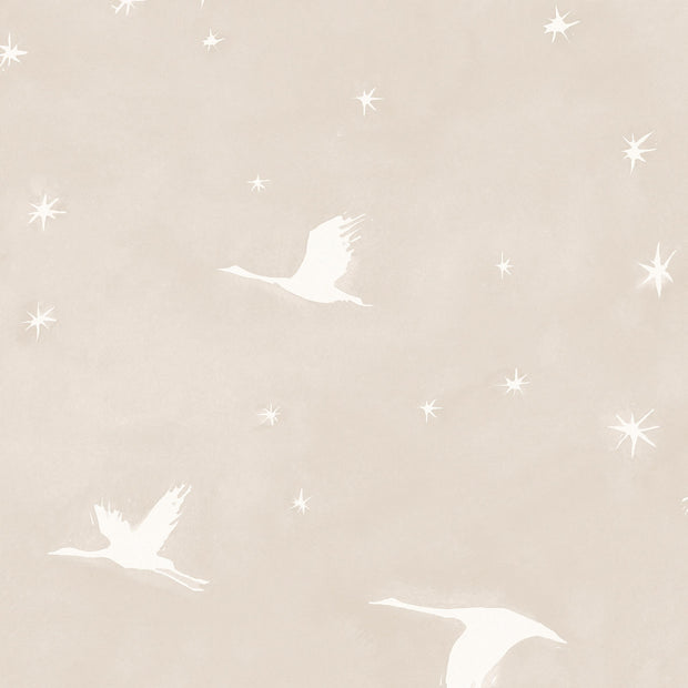 A yard of wallpaper featuring a graphic pattern with birds and stars on a beige background.