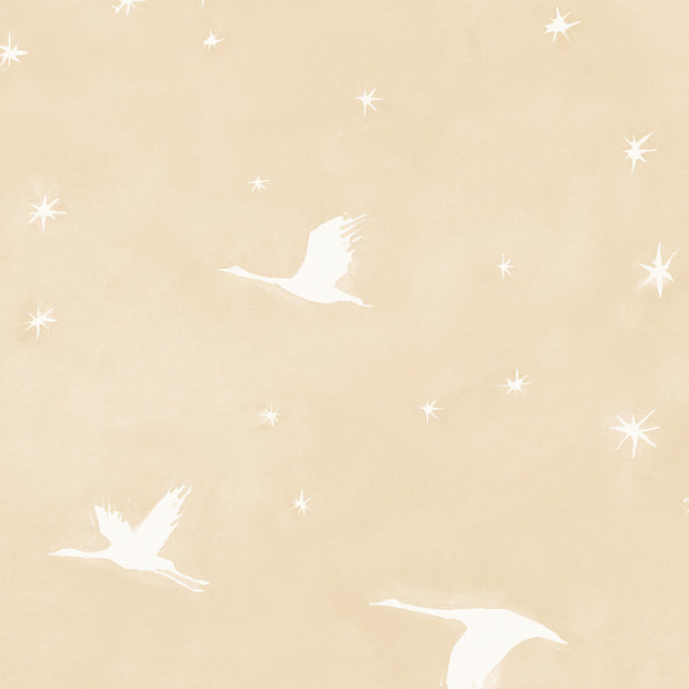 A yard of wallpaper with a starlit pattern featuring birds and stars on a beige background.