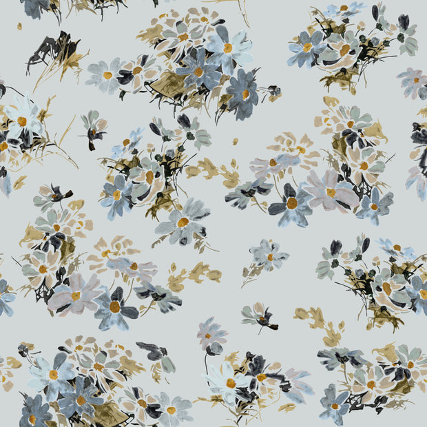 A wallpaper with a floral pattern featuring various flowers in shades of blue, green, and gray. Flowery Fields Wallpaper – Blue | Elegant Floral Wall Mural by Roll