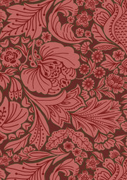 A red fabric with a traditional floral pattern.