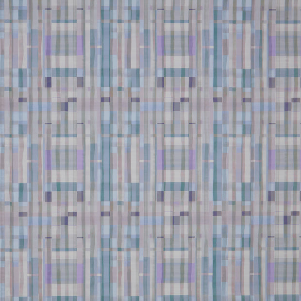 A section of wallpaper with a geometric plaid pattern in shades of blue, gray, and purple.