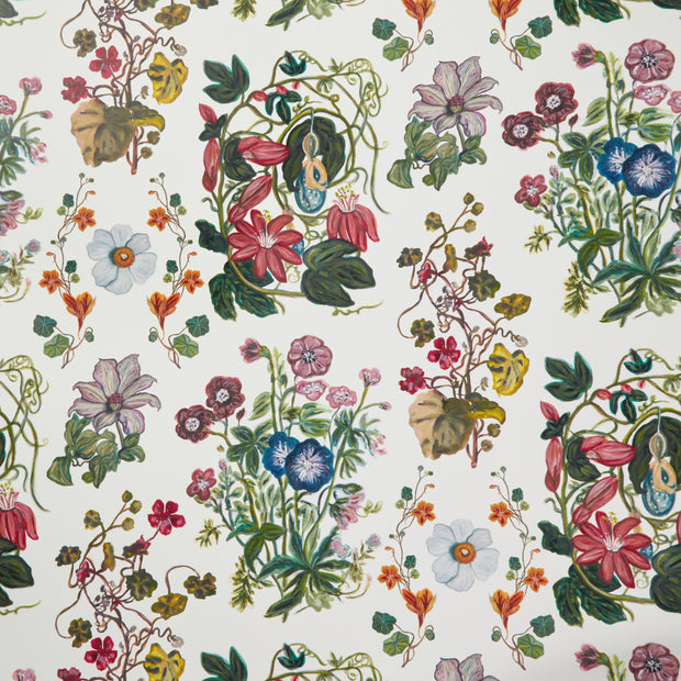 A wallpaper with a floral pattern featuring various colors including blue, green, orange, pink, and purple - One Colorway Garden Variety Wallpaper – 54" Wide, Sold by Yard