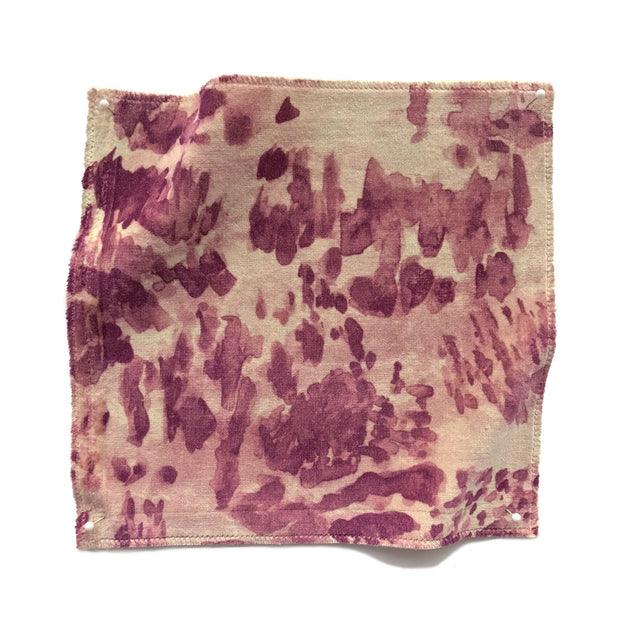 A swatch of heather velvet fabric in beige, blush, and pink with an abstract pattern.