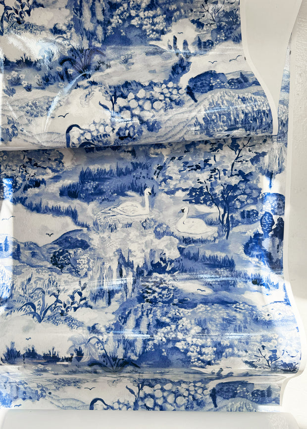 A wallpaper featuring a vibrant floral and animal pattern with a predominantly blue color scheme - Delftware Meadow Wallpaper – Laura Chautin Artist Series Wallcovering