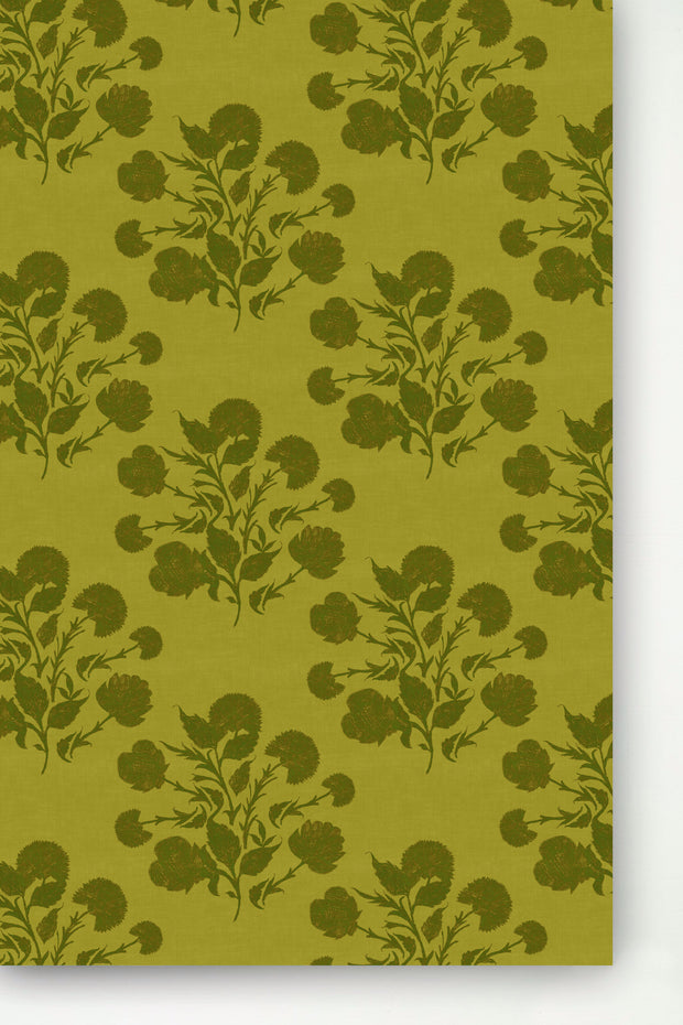 A panel of wallpaper with a dark green floral pattern on a yellow background.