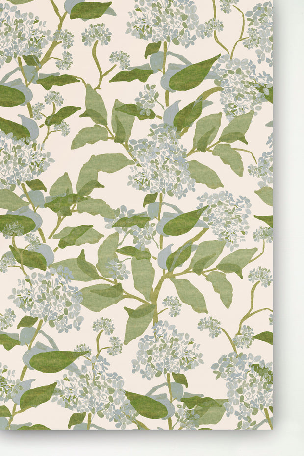 A wallpaper with a floral pattern featuring beige and green colors, and large blue hydrangea flowers.