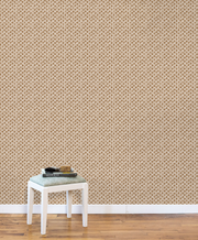 Beige wallpaper with subtle pattern, white baseboard, and wooden floor. Copper - Madras Geo Wallpaper by Panel
