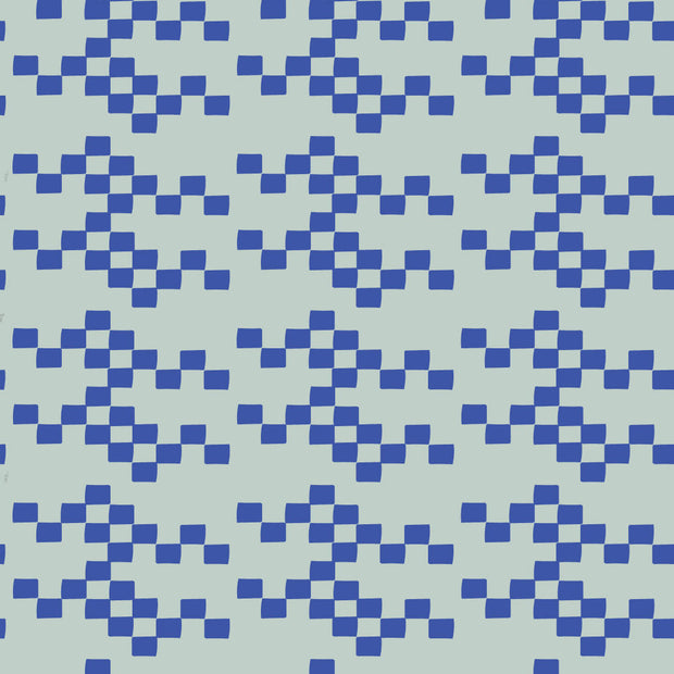 A close-up view of a blue wallpaper with a geometric checkered pattern. Pool Wallpaper – New Checker Pattern with Classic Retro Appeal