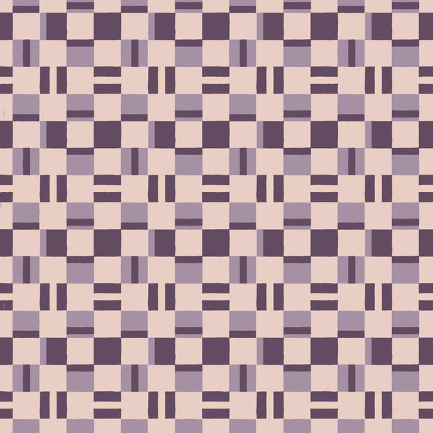 A close-up view of a wallpaper with a geometric pattern in purple and cream colors. Grape Wallpaper – Nookshelf Pattern with Modern Clay Finish