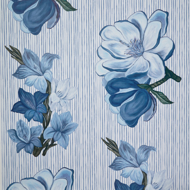 A wallpaper pattern featuring a series of floral designs with predominantly blue flowers, green leaves, and a striped background - Slate Blue Steel Magnolia Wallpaper – Oversized Floral Yard Wallpaper