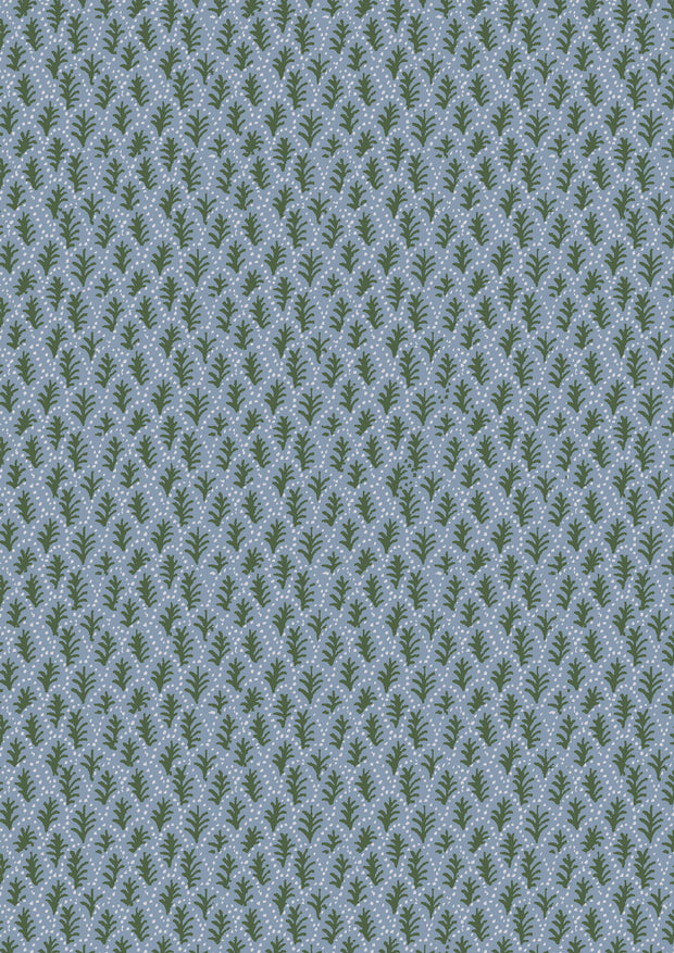 A textured blue fabric with a microprint pattern of green trees.