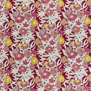 A piece of fabric with a floral pattern featuring red, yellow, and green colors on a maroon background.