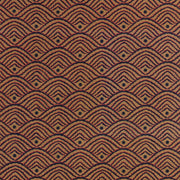 A close-up view of a textured fabric with a geometric pattern featuring shapes in a brown color.