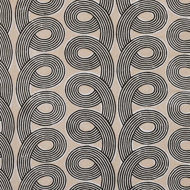 A yard of fabric featuring a beige background with a black geometric pattern of intertwined circles.