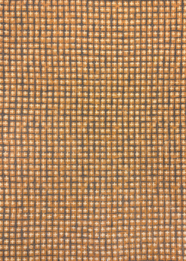A close-up image of a textile fabric with a geometric grid pattern in beige, brown, and gray colors.