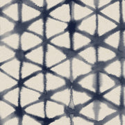 A section of wallpaper showing a geometric pattern with diamond shapes in a tie-dye style with varying shades of blue and beige on a white background - Morph Wallpaper – Indigo | Straight Match by Yard