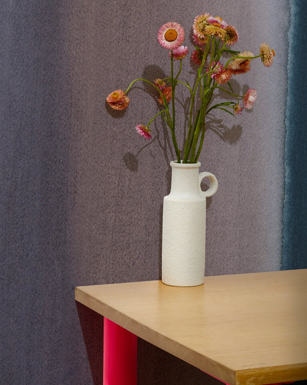 White vase with dried flowers on a wooden table against a gray wall. Deep Ocean Wallpaper – Flood Mural | Custom Type II PVC Free