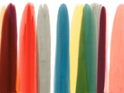 A series of abstract, contemporary wallpaper swatches in various colors including red, blue, green, grey, multi, pink, purple, and yellow.