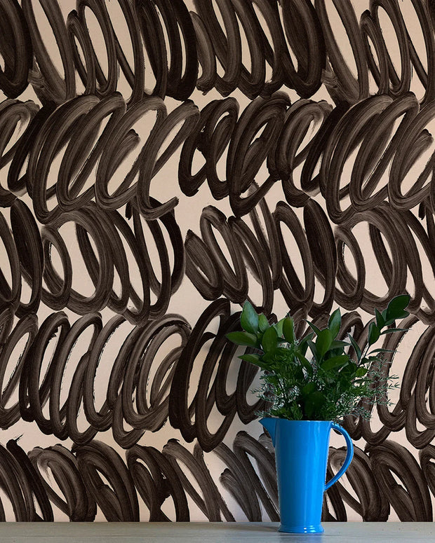 A wall adorned with black and beige geometric patterned wallpaper, featuring a blue mug with a plant beside it - Opera Wallpaper – Whisper Collection | Non-Woven