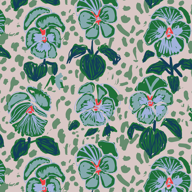A fabric with a floral pattern featuring large leaves and small flowers in shades of blue, green, and multicolor on a light background.