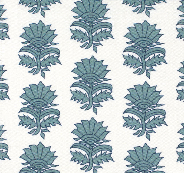 A fabric with a floral pattern featuring indigo and white colors on a natural background.