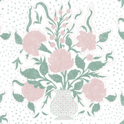 A fabric featuring a floral pattern with pink and green flowers and leaves on a white background with a dotted pattern.