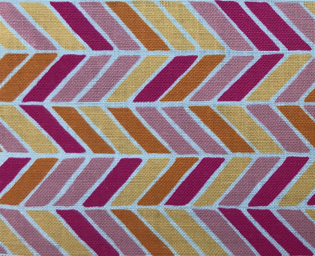 A fabric featuring a herringbone pattern with alternating colors of pink, orange, white, and yellow, and a border in a lighter shade.
