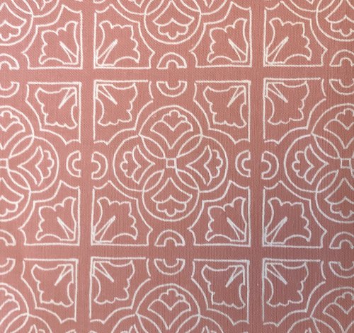 A fabric with a geometric reverse Irish tile pattern in pink and white colors.