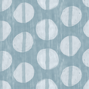 A fabric with a blue background and a white circle pattern repeated over it.