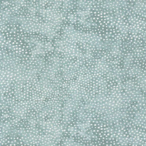 A close-up view of a textured fabric with a blue color and a dotted pattern.