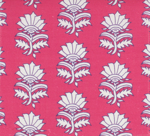 Fabric with a pink background and a white floral pattern resembling thistles or lilies.