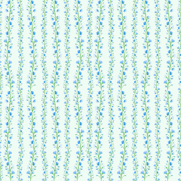 A wallpaper with a floral pattern featuring twirling blue blooms on a green background. Cornflower Twirling Blooms Wallpaper – Clay Coated | Sold by Roll | 5–7