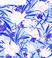 A roll of wallpaper with a floral pattern featuring blue and pink flowers on a white background. Yves Everyday Blooms Wallpaper – Clay Coated Floral Roll Design