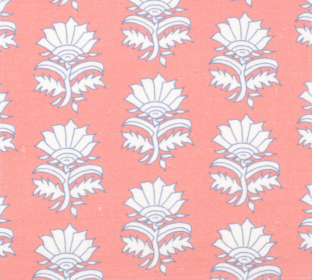 A fabric featuring a white thistle pattern on a pink background.