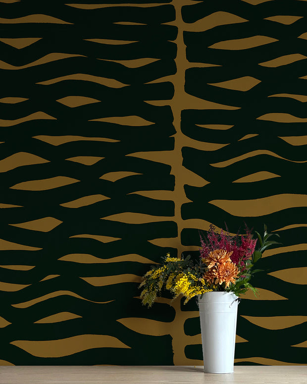 A wall adorned with black and yellow geometric patterned wallpaper, featuring a vase with flowers in front. Caiman Wallpaper – Zag | Non Woven Double Roll Design